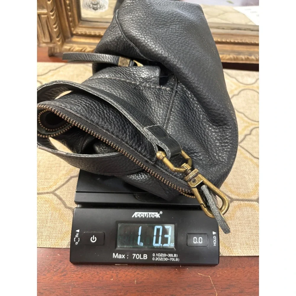 The Sak Alameda Hobo Bag Medium Black Pebbled Leather Feather Fringe Charm